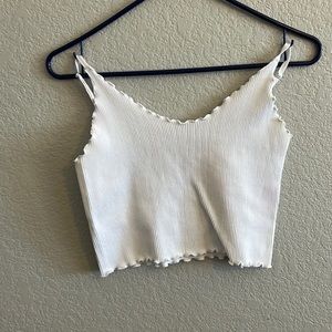 Small stain on the back, all white. Worn a couple of times